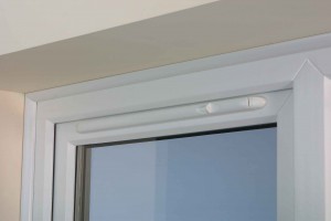 Trickle vent in double-glazed window