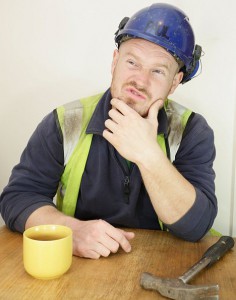 Dodgy builder with a hammer and a cup of tea