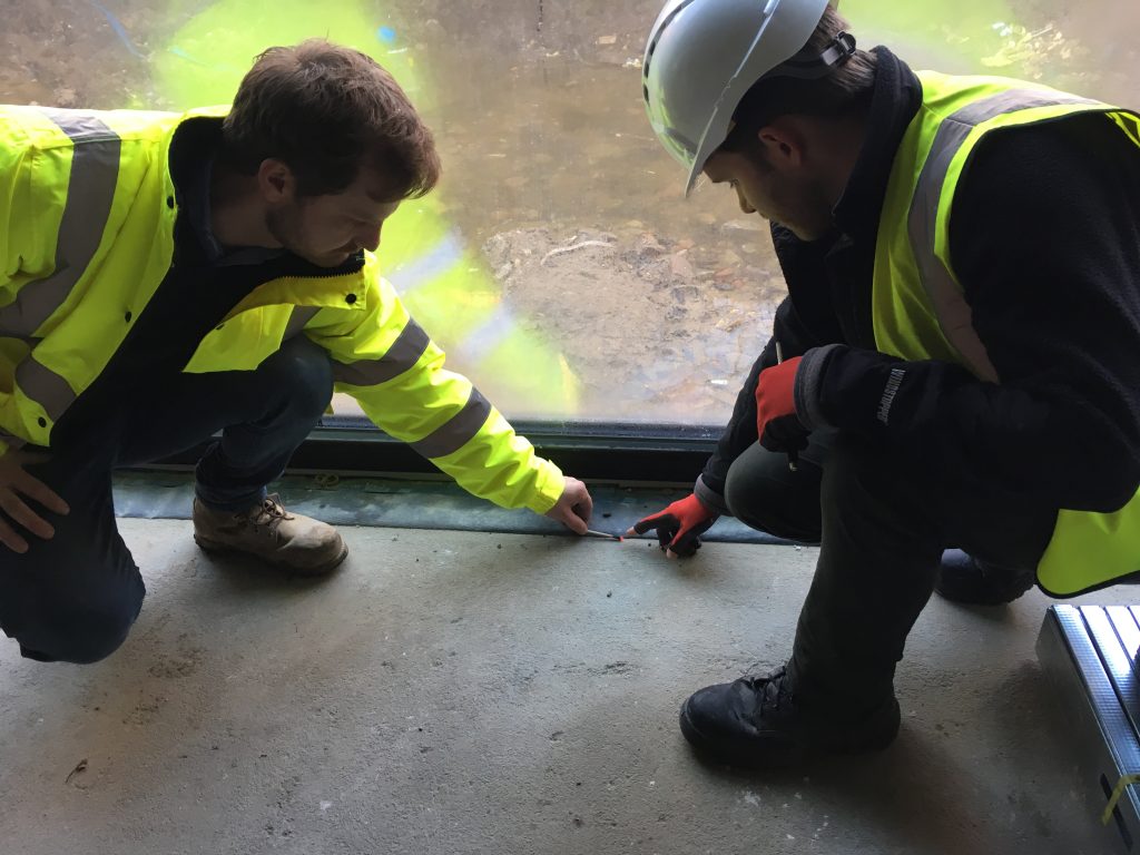 Using a smoke pen to detect leaks during airtightness testing