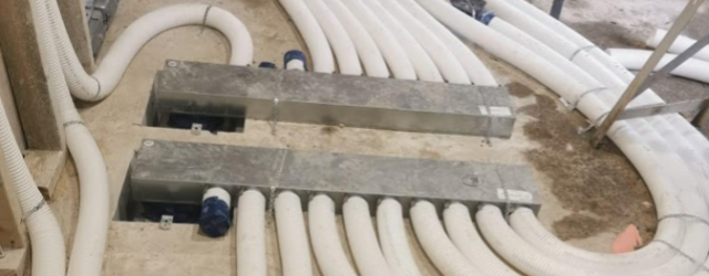 Manifolds for a radial semi-rigid ductwork system mounted on concrete floor