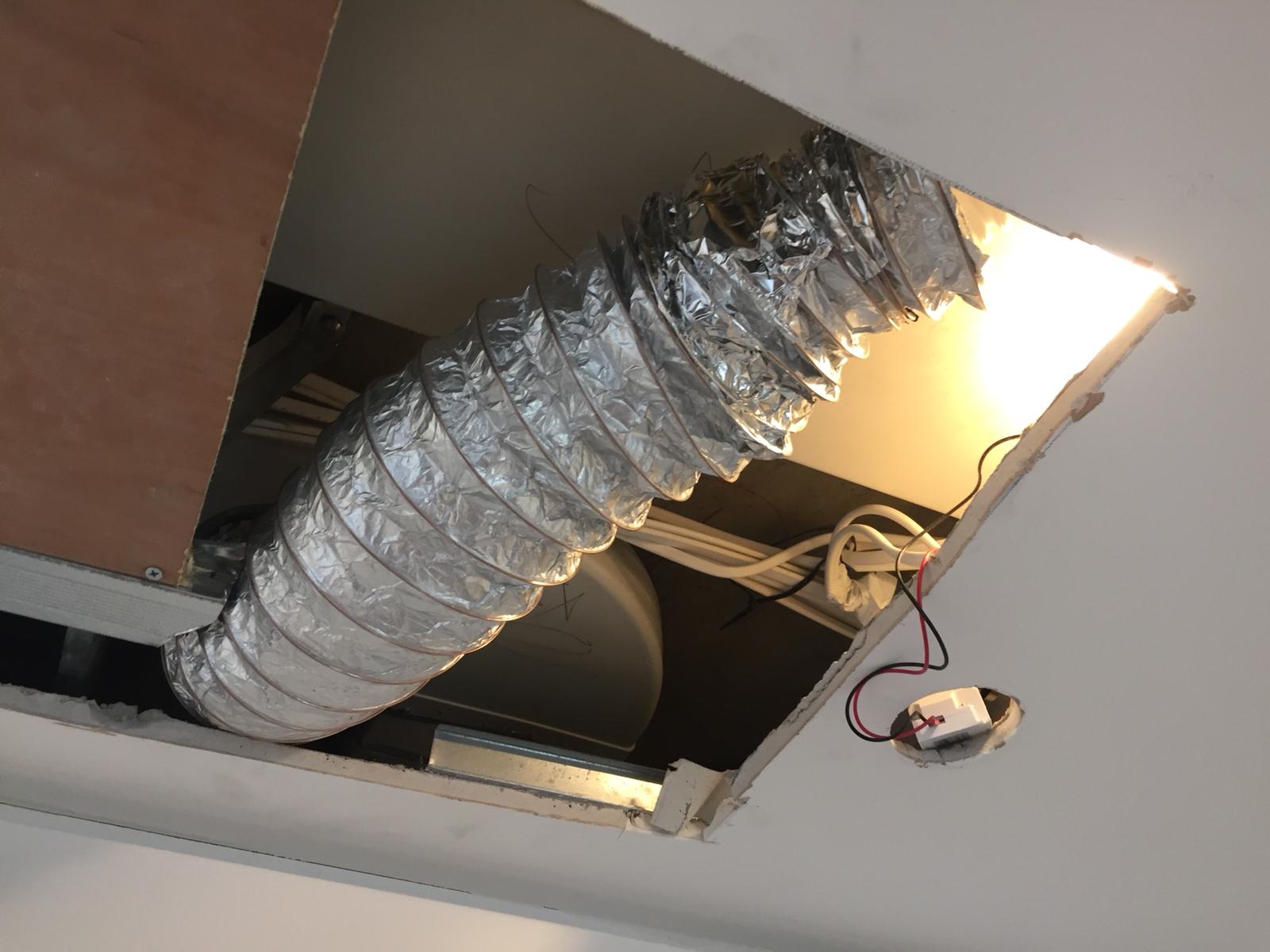Badly fitted flexi-duct used to make ducting fit - poorly taped MVHR