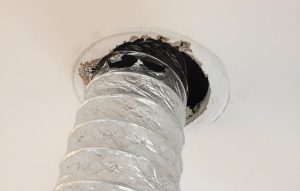 Terrible use of flexi-duct at room valve in an MVHR - torn as well