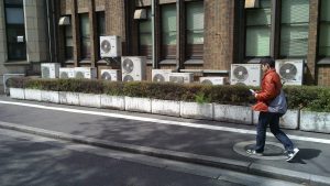 Air conditioning units scatter the exterior of a building