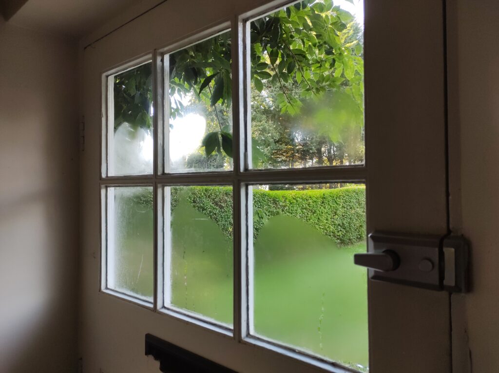 Condensation on a cold single-glazed window in winter