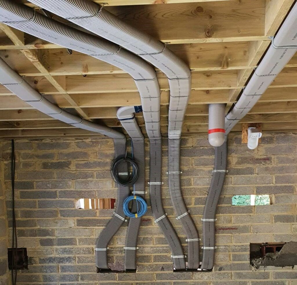  Flat 51mm ducting pinned to wall and rising into ceiling area