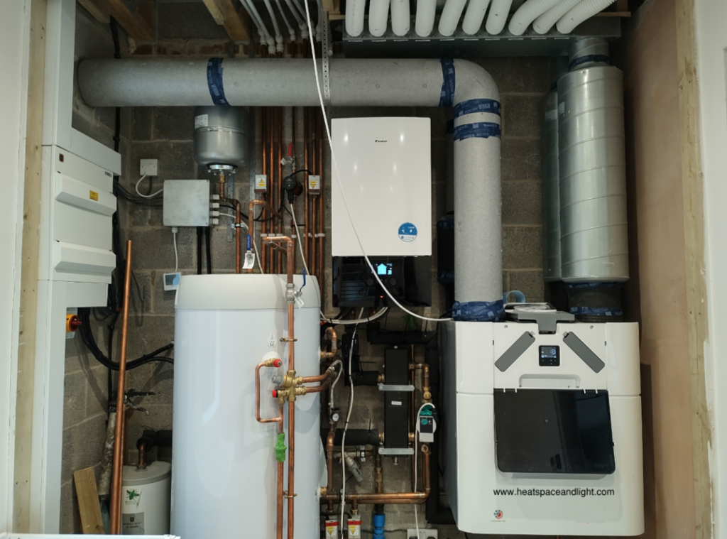 MVHR system installed into plant room next to Air Source Heat Pump and hot water cylinder