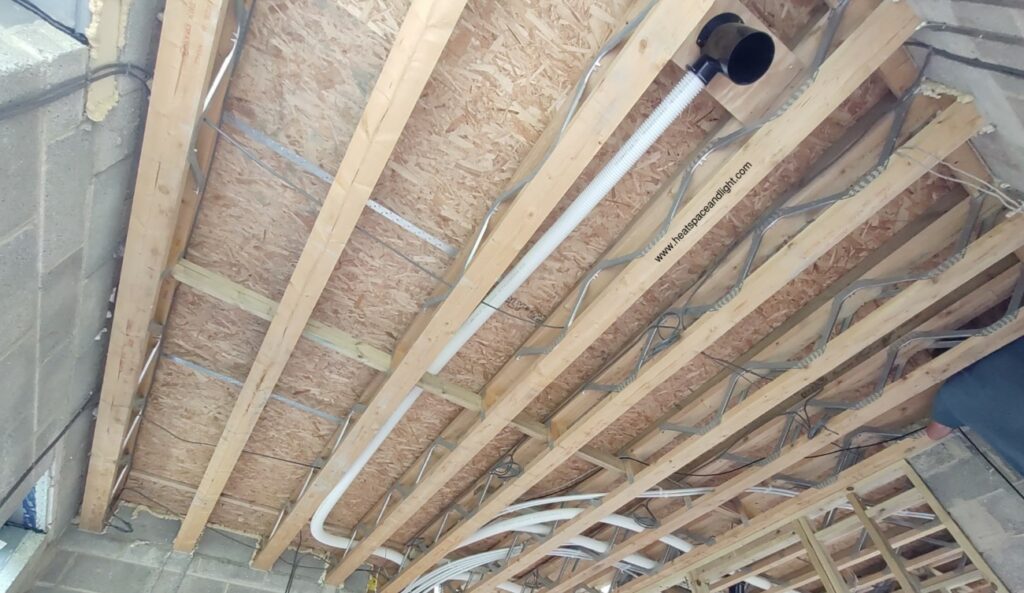 Radial ducting installed in webbed joists with sweeping bends
