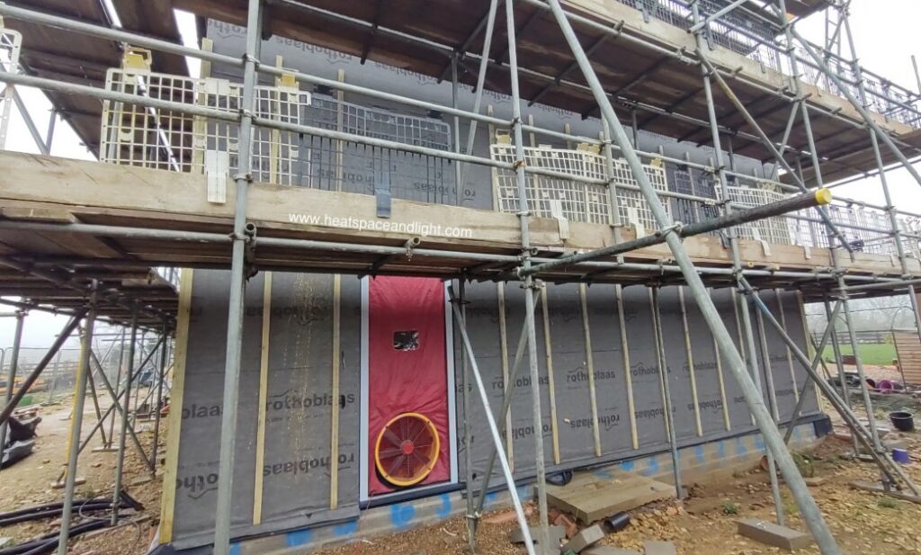 Airtightness blower door kit at dutch barn new build 