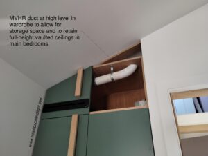 Lamina supply air grille installed into wardrobe door in vaulted ceiling bedroom